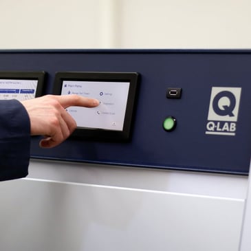 lab techncian programming a quv weathering tester 