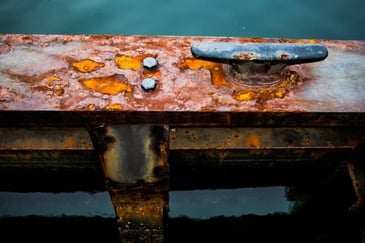 steel corroding with rust needs testing in a q-fog corrosion testing chamber
