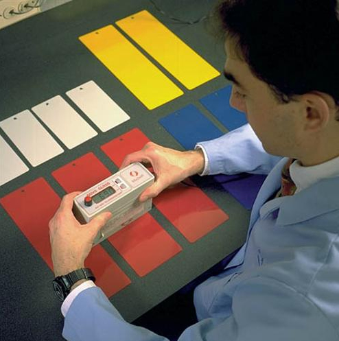 technician measuring test substrates using a measuring device